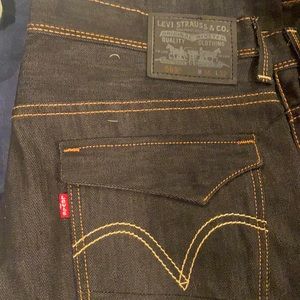 Black denim Levi’s with tan stitching